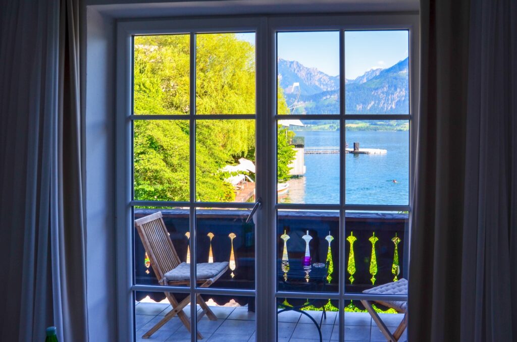 people sitting on chairs near window during daytime