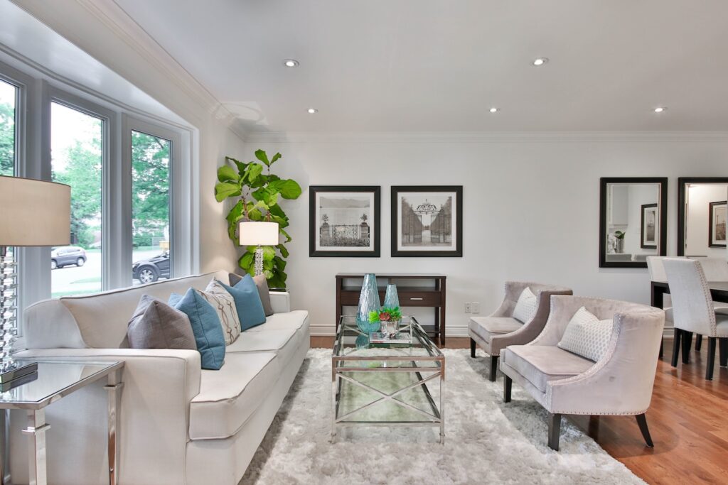 living room with white sofa and glass coffee table