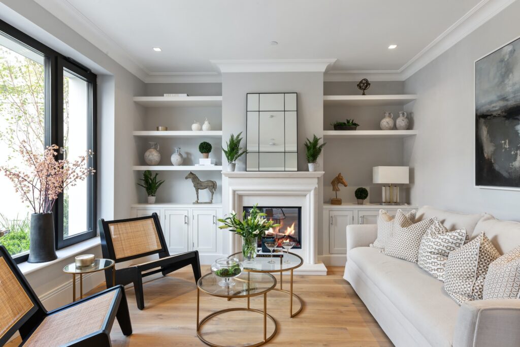 a living room filled with furniture and a fire place