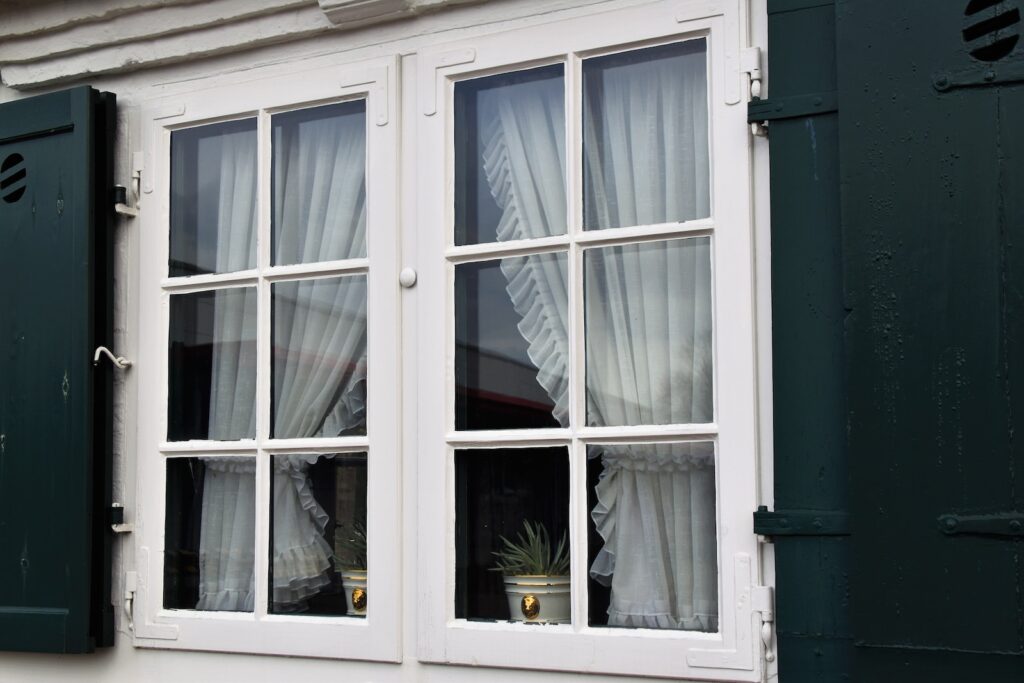 white wooden framed glass window