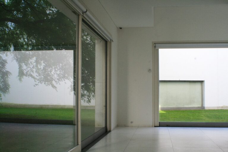 an empty room with a sliding glass door