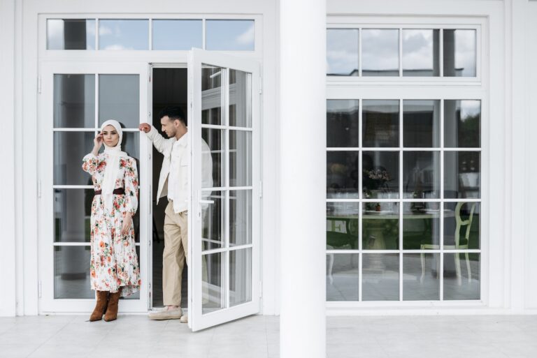 A Couple Standing by the Doorway