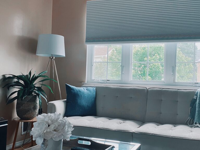 white and black bed near window