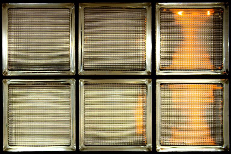 a close up of a window with a reflection of a person