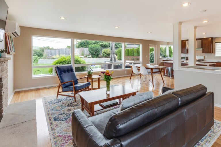 brown leather couch in front of brown wooden coffee table