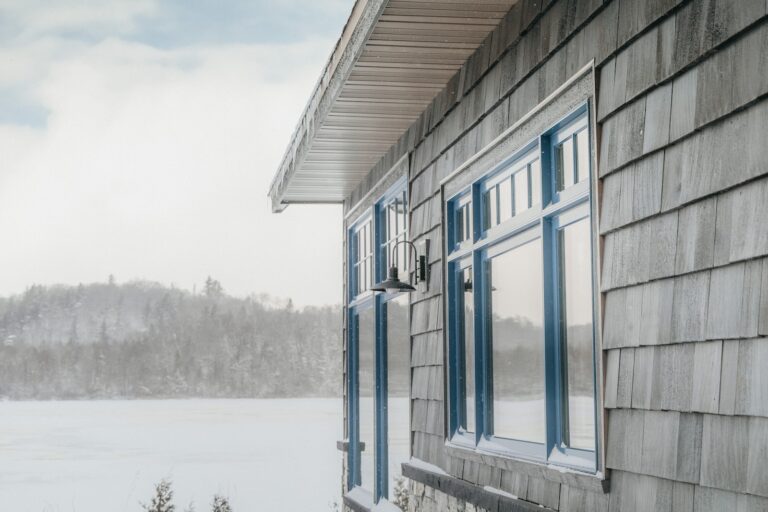 a house with a lake in the background